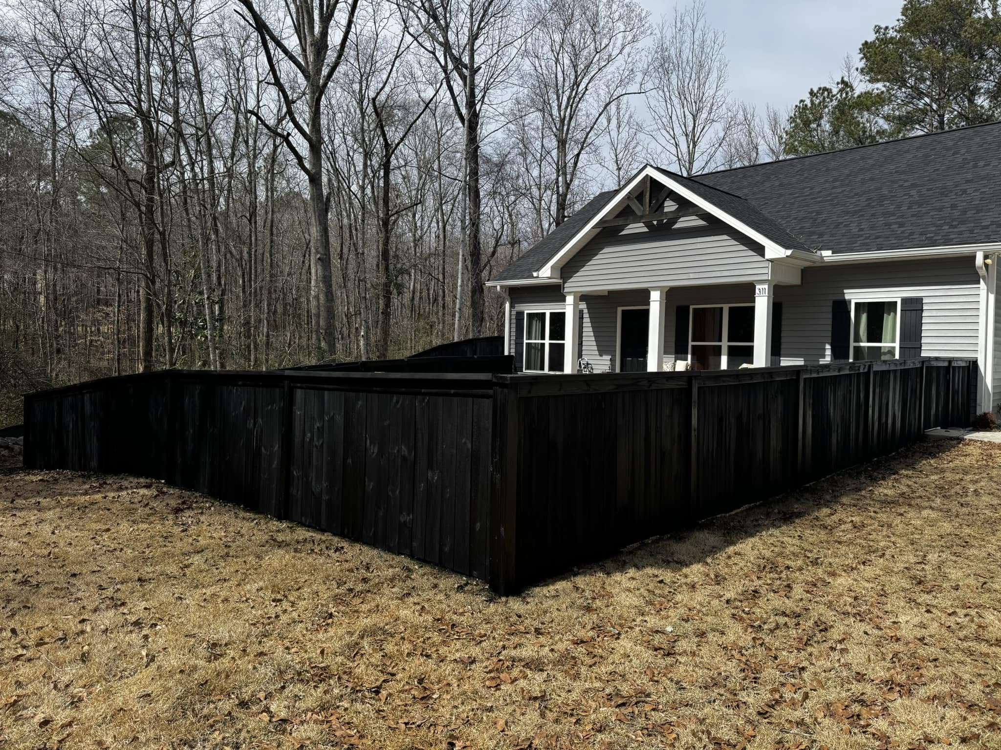 Stained Black Wood Privacy Fence