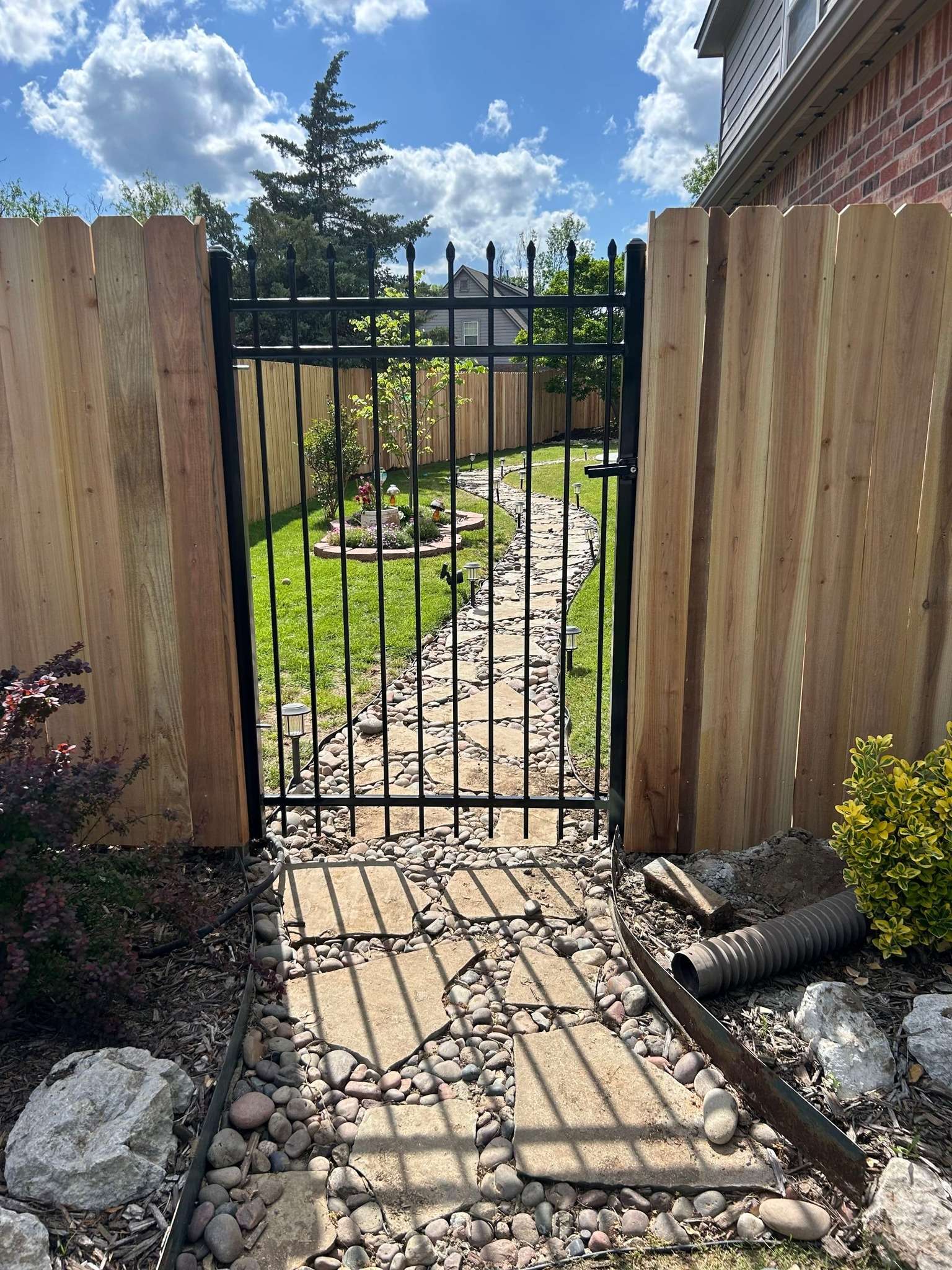 Wood Privacy Fence with Ornamental Metal Gate